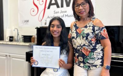 Kavya Ravi receiving the CM level 10 certificate and Senior Award from Music Teachers Associaton of California (MTAC). – JULY 2022